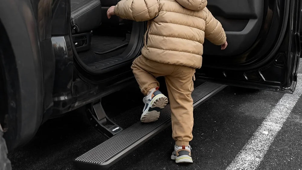 Deployed power running board providing a safe lower step for a child.