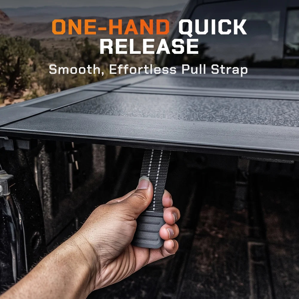 Close-up of one-hand quick release strap on ToughFold T1 hard folding tonneau cover for easy truck bed access and operation