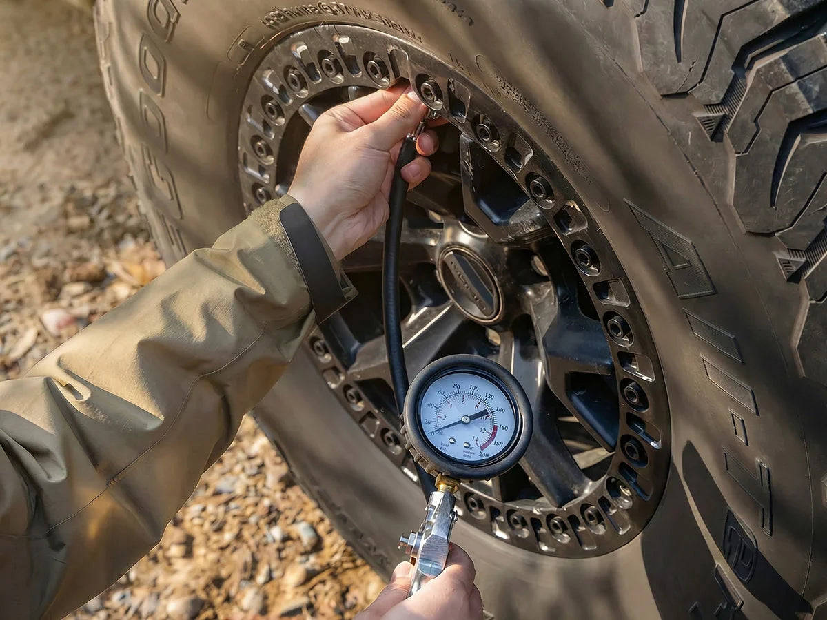 Built-in tire pressure gauge for checking and inflating tires