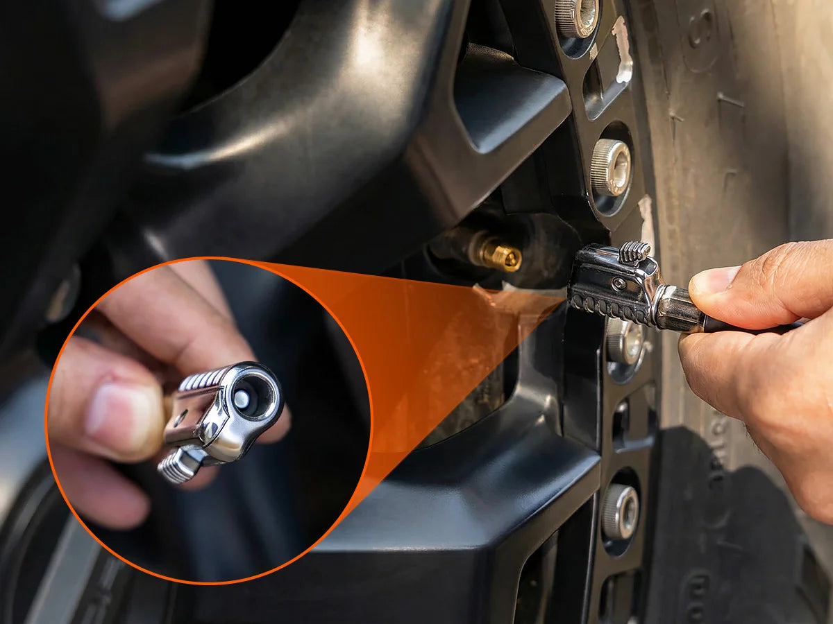 Close-up of the patented anti-scald quick connect air chuck with locking mechanism for safe tire inflation.