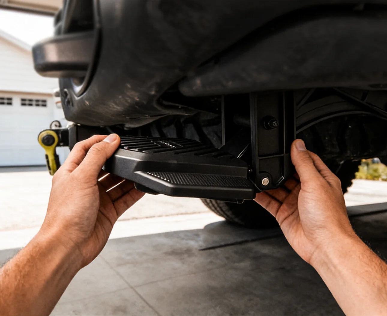 Simple no-drill bolt-on installation of a WOLFBOX retractable step on a truck chassis.