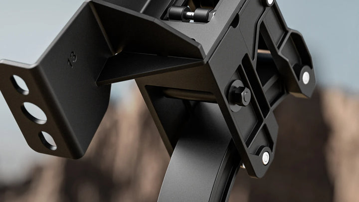 Close-up of a high-strength aluminum alloy retractable step bracket featuring a textured black protective finish.