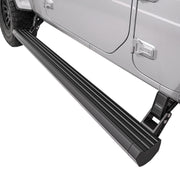 Black electric running board fully deployed on a silver Jeep, showing the low step position for easy cabin entry and exit on SUVs and pickup trucks.