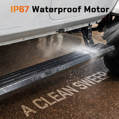 Water splashing onto a Wolfbox electric running board's IP67-rated motor housing, demonstrating all-weather waterproof protection in rain, mud, and off-road conditions.