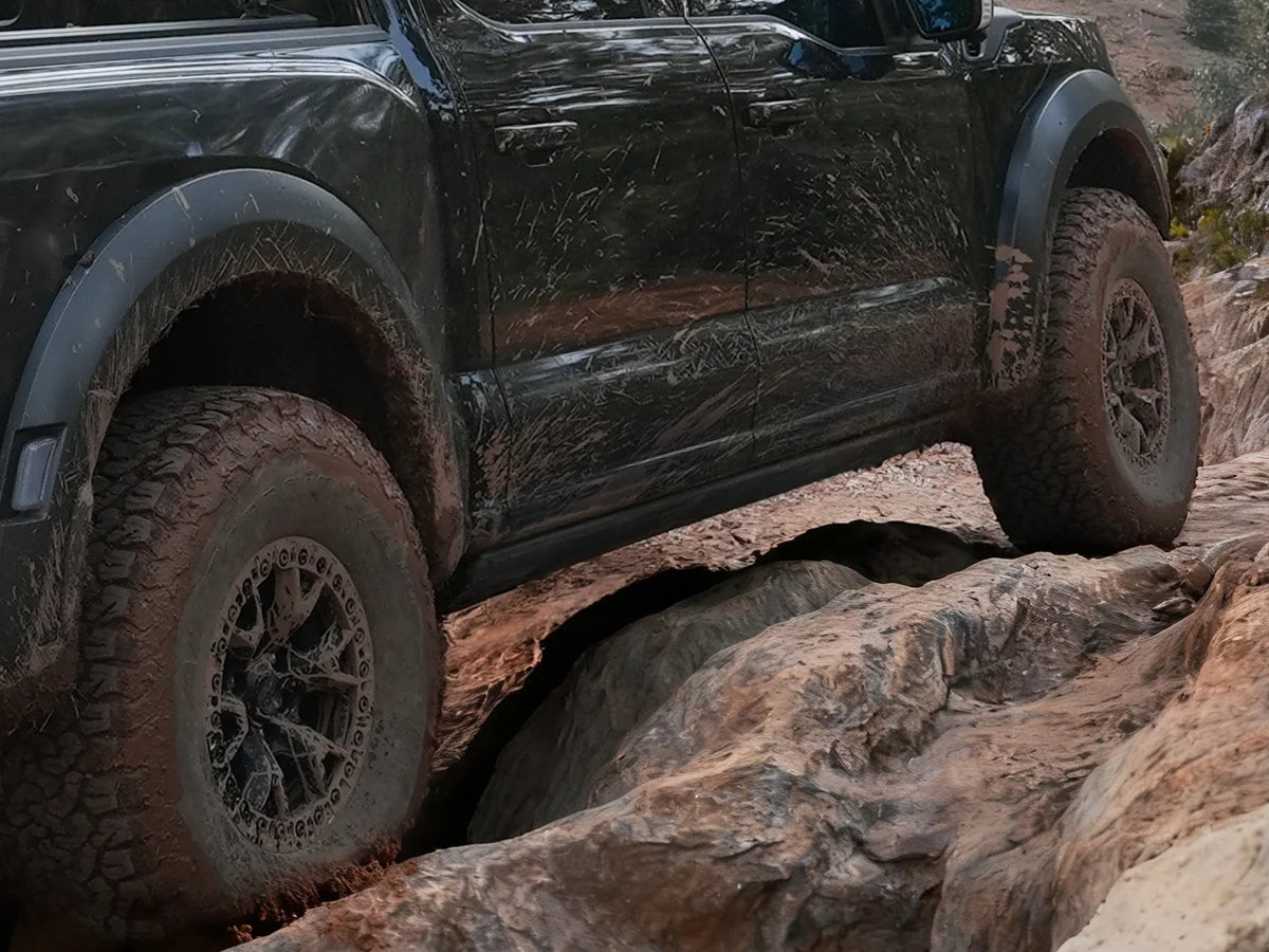 High-tuck power steps providing maximum ground clearance for off-road trail capability and convenience.