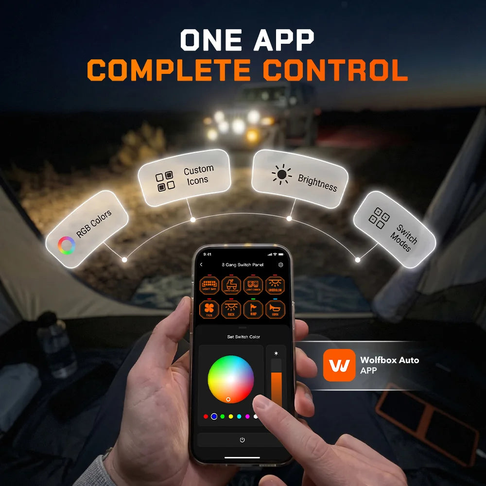 Driver controlling a Wolfbox smart switch panel from a smartphone app in a darkened truck cab, with on-screen sliders for engine start, lights, brightness, and accessories.