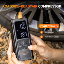 palm sized tire inflator held in two hands for quick roadside tire topping up | WOLFBOX HyperFlow19